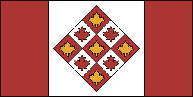 Drapeau rouge, blanc et or, avec 2 bandes rouges de chaque côté d’un losange au centre. Le losange est divisé en 9 sections, avec 1 feuille d’érable dans chacune d’elles.